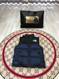 The North Face Puffer Vest in Navy and Black with Stand Collar
