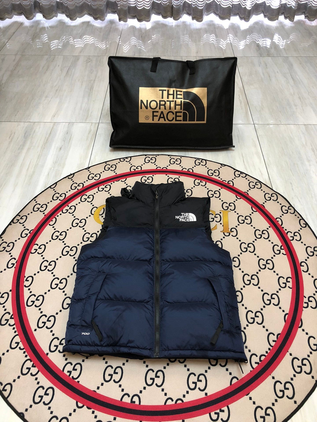 The North Face Puffer Vest in Navy and Black with Stand Collar